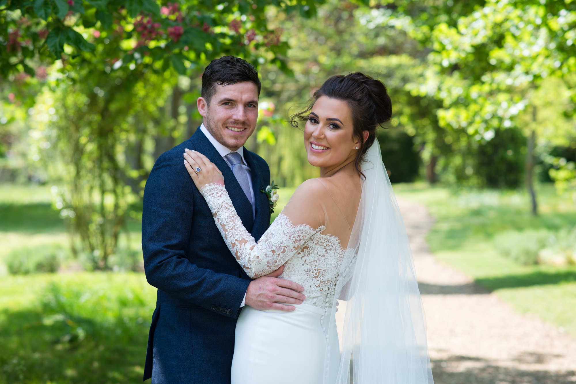 A bride and groom having their wedding photography at Chippenham park in Cambridge
